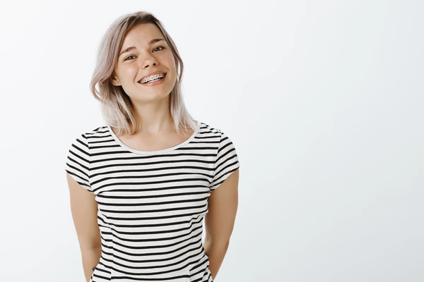 cute-blonde-girl-posing cute girl wearing invisalign